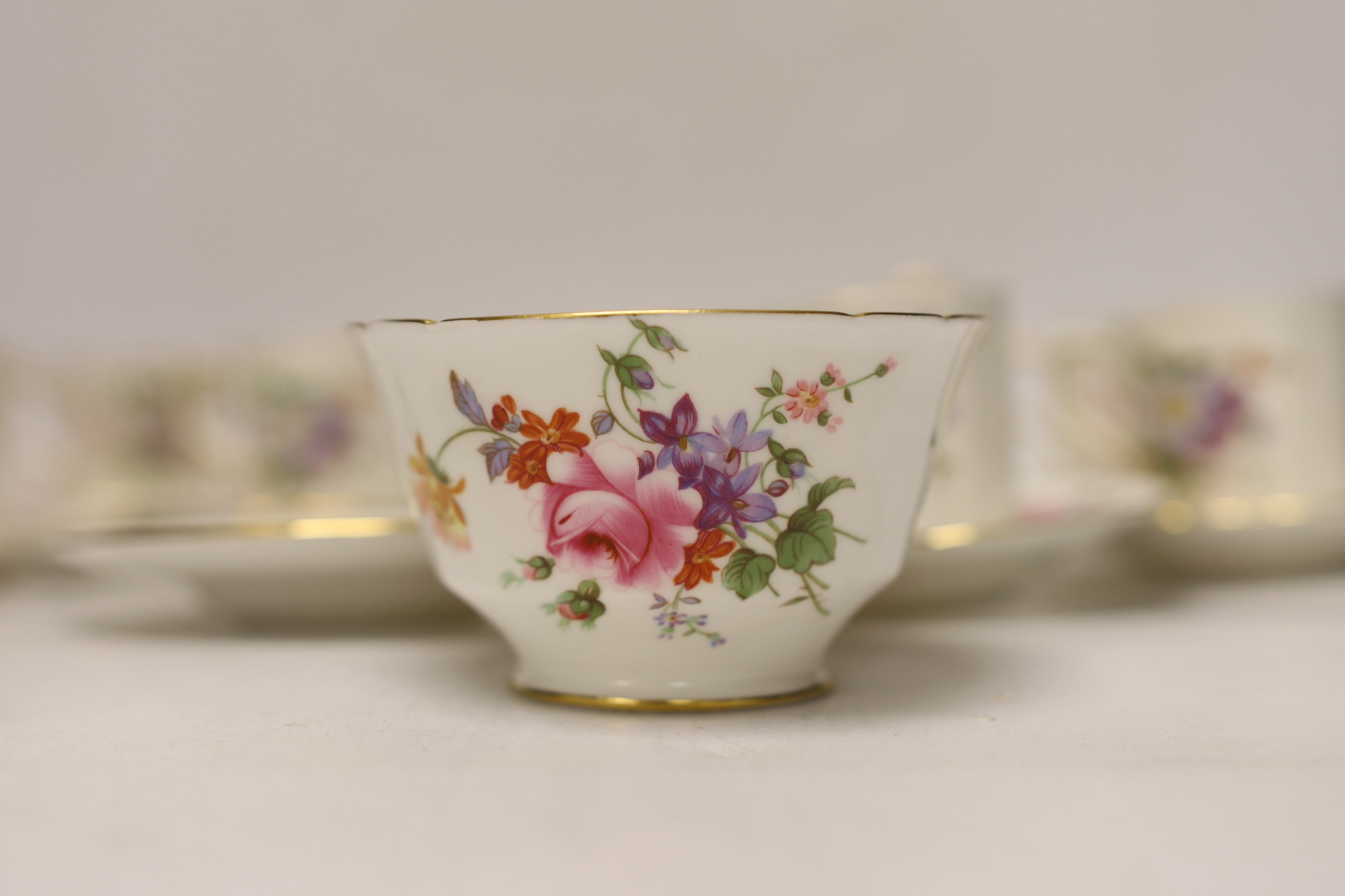 A Royal Crown Derby Posies coffee set comprising of seven cups and saucers, a sugar bowl and milk jug